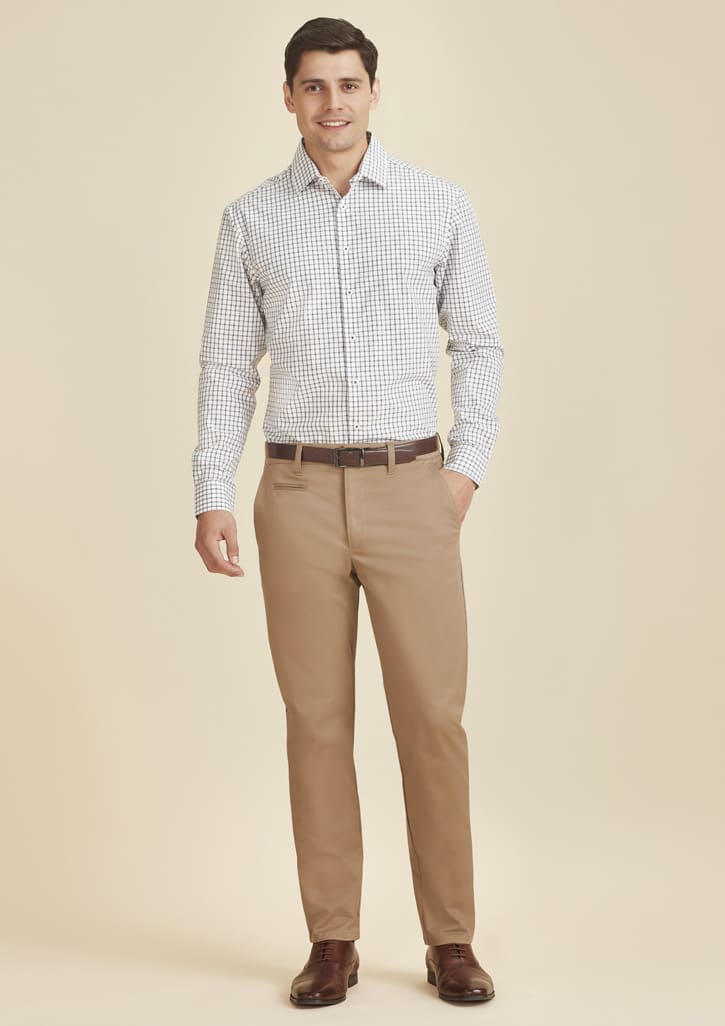 A man models modern stretch chino pants in a light tan colour, paired with a checked shirt. The outfit features a belt.