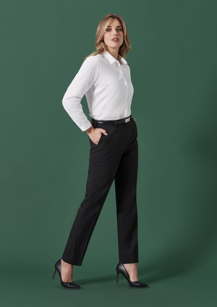 A pair of black tapered adjustable waist pants displayed on a model, paired with a white shirt and black heels.