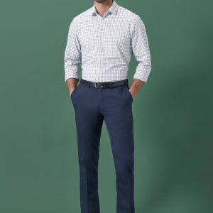 Men's adjustable waist straight leg pants in navy, paired with a checkered shirt. The model stands against a green background.