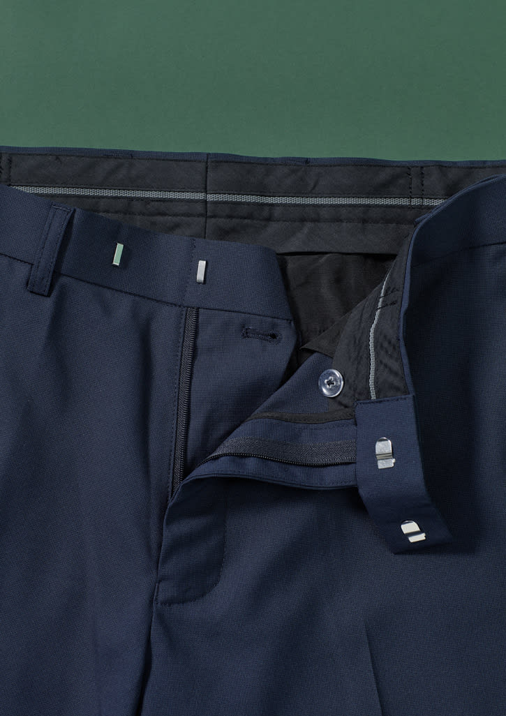 A pair of navy blue straight leg pants featuring an adjustable waist and a side button closure. The fabric is smooth and tailored.