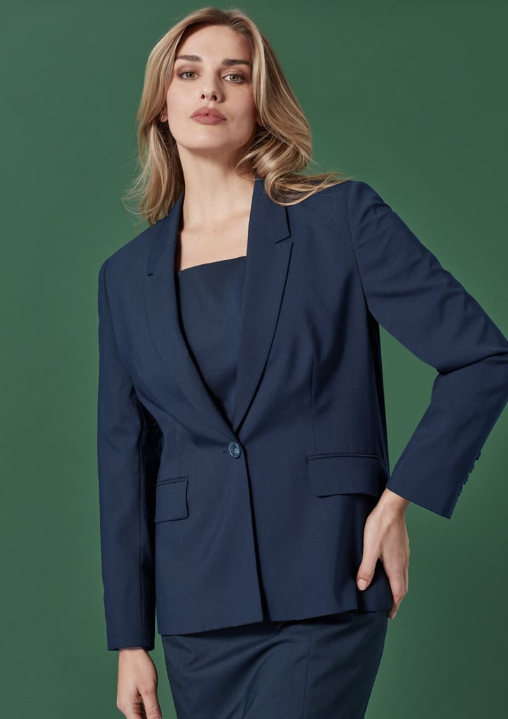 A double-breasted longline jacket in navy blue with structured shoulders and a sleek silhouette, featuring a logo.
