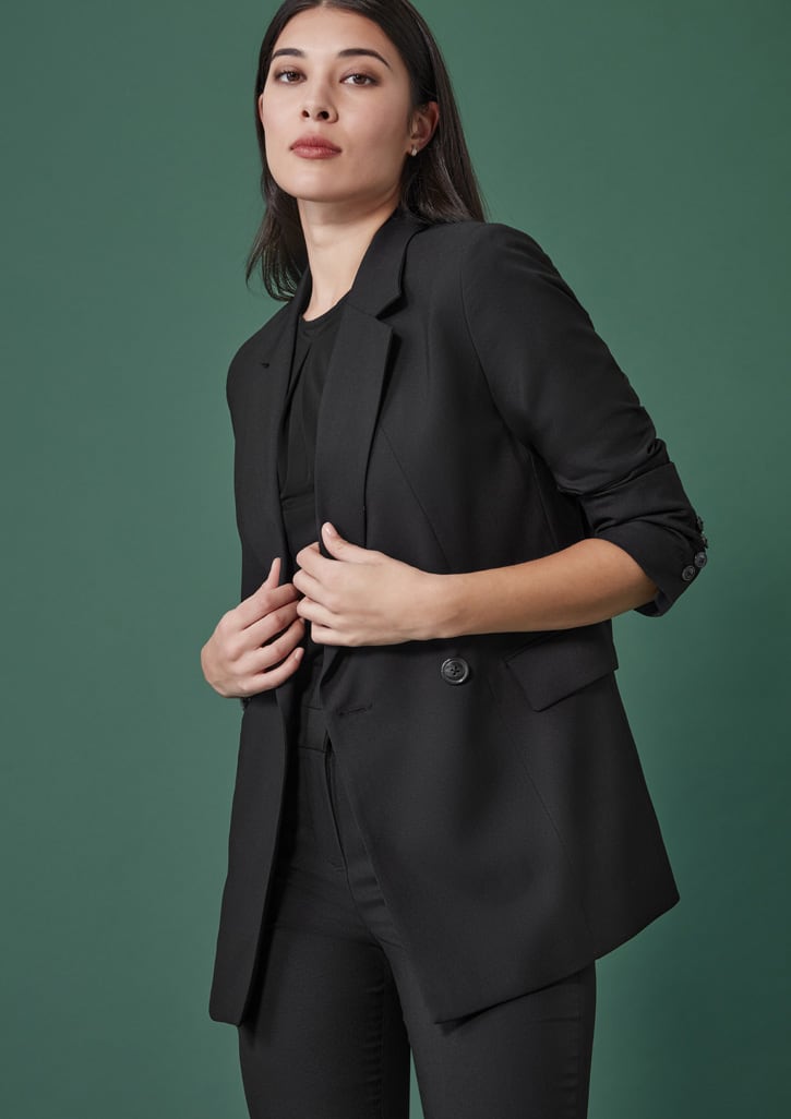 A black longline double-breasted jacket on a model, featuring a tailored fit and stylish design.