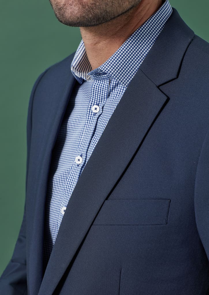 A navy blue men's jacket with a slim fit, featuring a single chest pocket and a checkered shirt underneath.