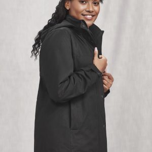 A black women's comfort jacket with a high collar and pockets, featuring a logo. Model is smiling and posed.
