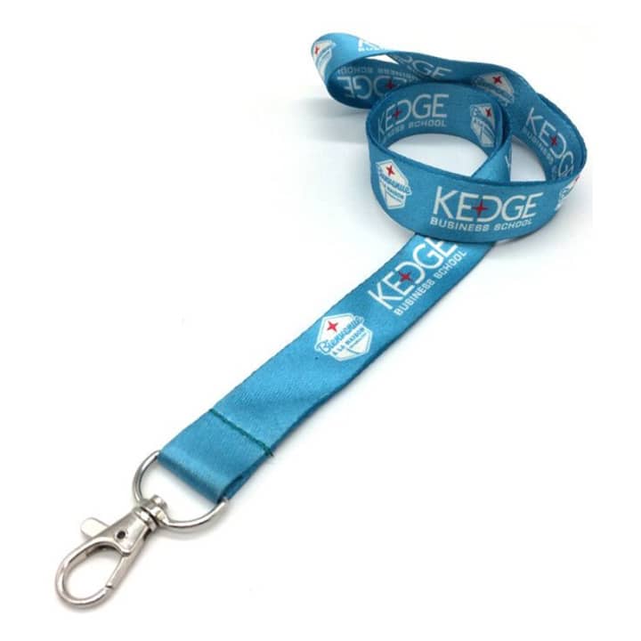 A blue lanyard with a silver clip, featuring printed logos and designs along its length.
