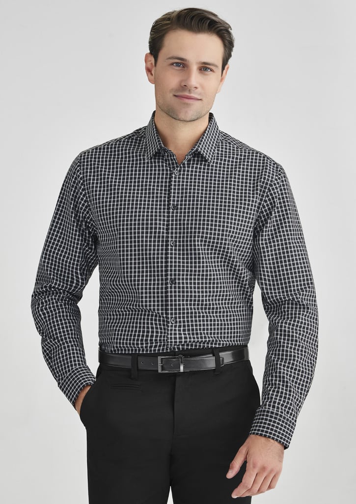 A black and white check pattern long sleeve button-up shirt worn by a man, paired with black trousers.