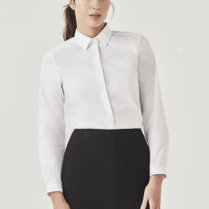 A white long sleeve button-up shirt displayed on a model, paired with a black skirt. The shirt has a collar and features a logo.