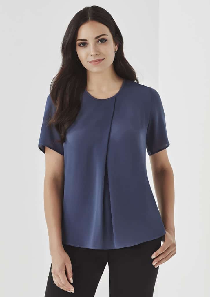 A short-sleeve, navy women's T-top with a rounded neckline and a subtle front pleat, featuring a branding logo.