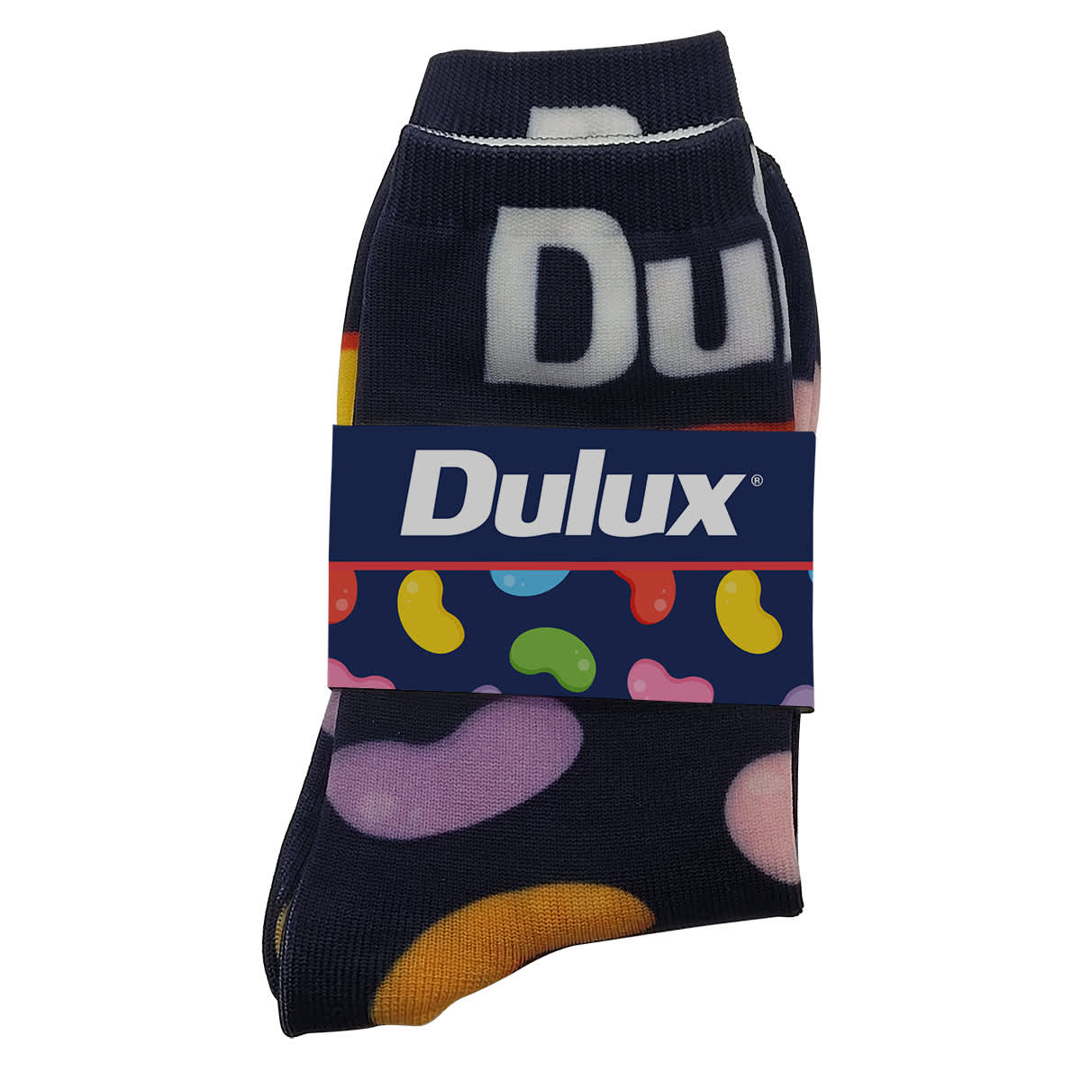 A pack of Magic Seamless Socks in dark blue with colourful jelly bean patterns, featuring a branding label.