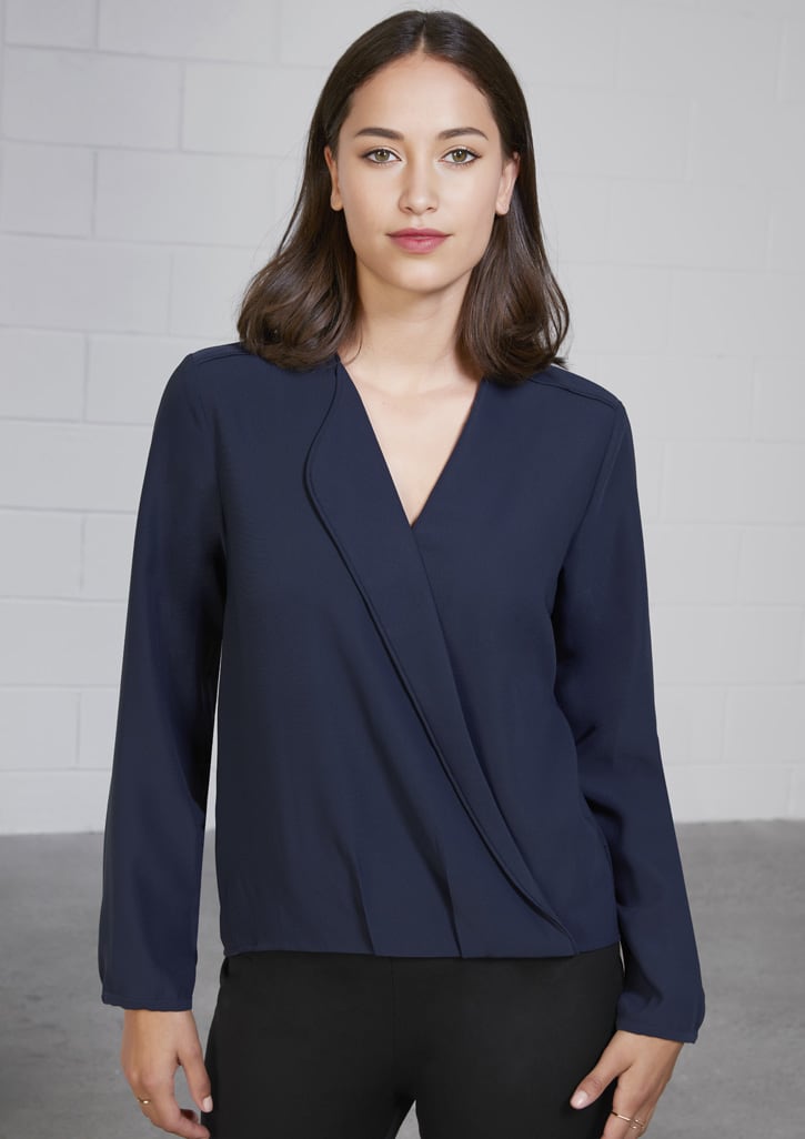 A navy blue women's button-up blouse with long sleeves and a hi-lo hem design. Features a sleek, wrap-like front.