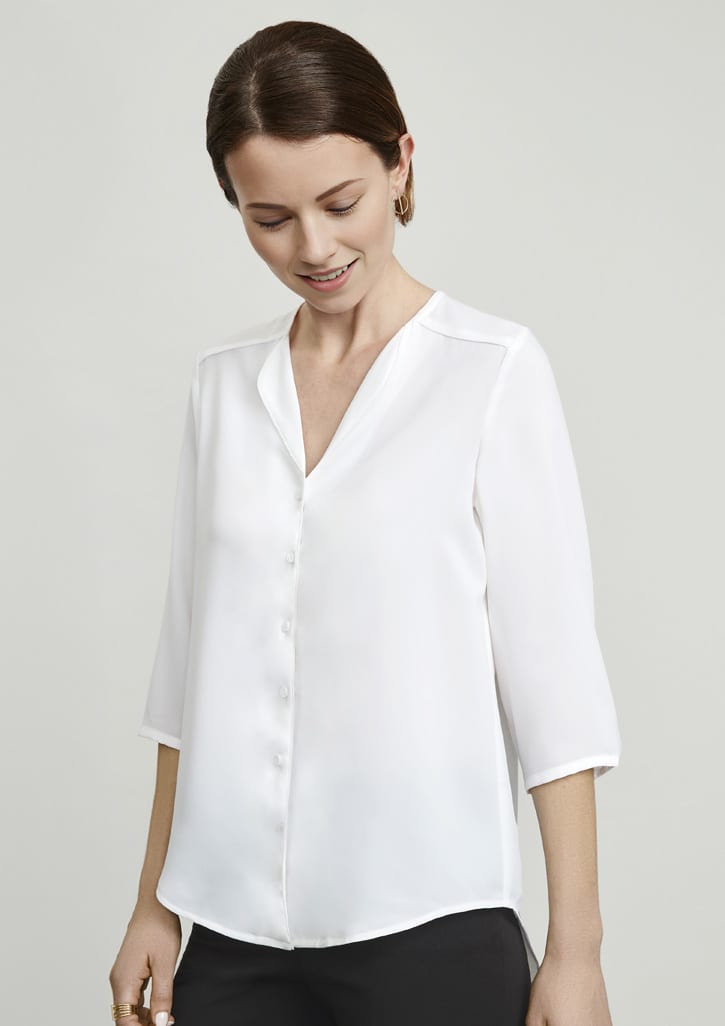 A button-up women's blouse in white with a v-neck and three-quarter sleeves, featuring a subtle sheen.