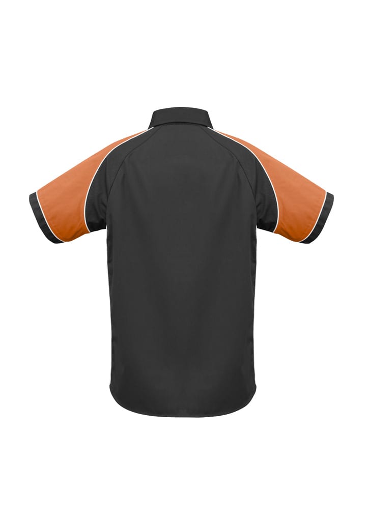 A black short sleeve shirt with orange accents and a logo on the chest area.