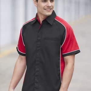 A men's short sleeve button-up shirt in black and red, featuring a contrasting design and pocket.