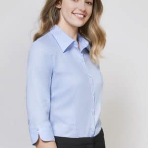 A light blue women's button-up shirt with 3/4 sleeves, featuring a collar and a fitted design.