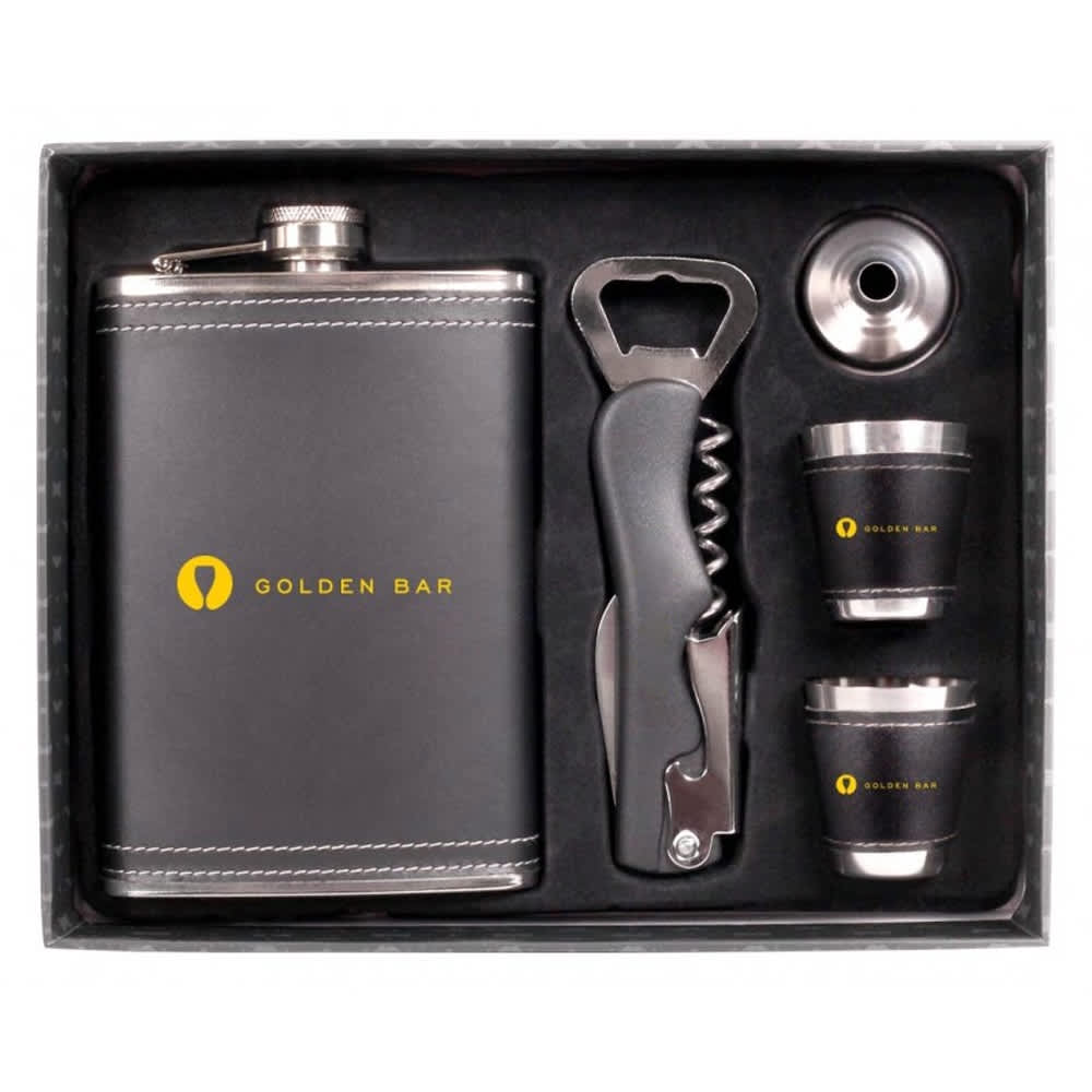 A drink bottle set featuring a silver flask, two shot glasses, a bottle opener, and a corkscrew, presented in a box with a logo.
