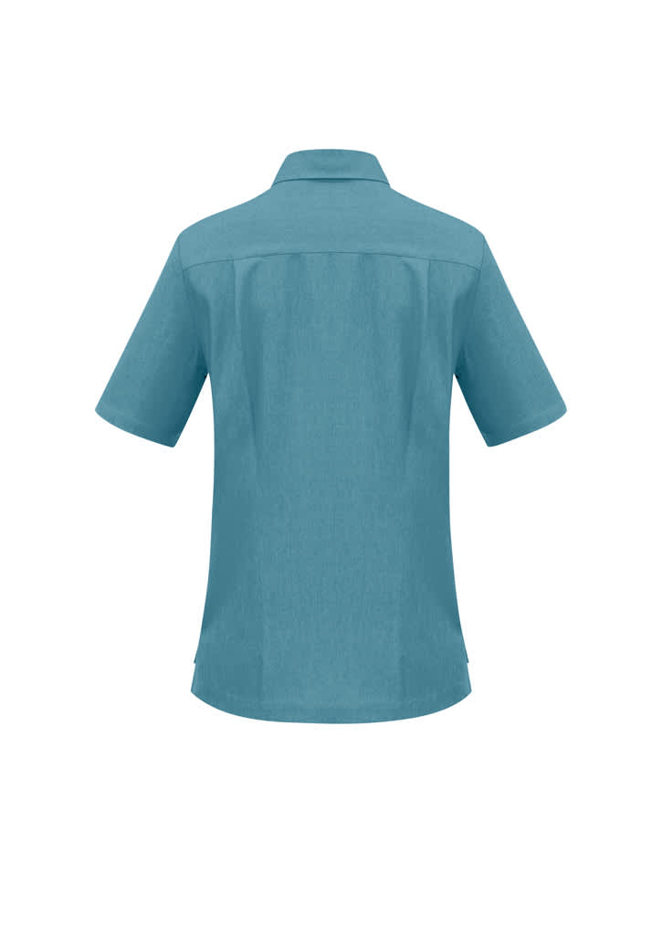 A teal ladies overblouse featuring a collared neck and short sleeves, with a logo on the back.