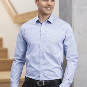 A men's long sleeve button-up shirt in a light blue check pattern, featuring a collar and a logo patch.