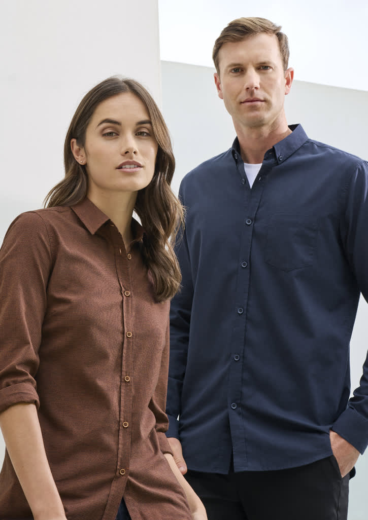 A brown long sleeve button-up shirt for women, paired with a blue button-up shirt for men, both featuring a logo.