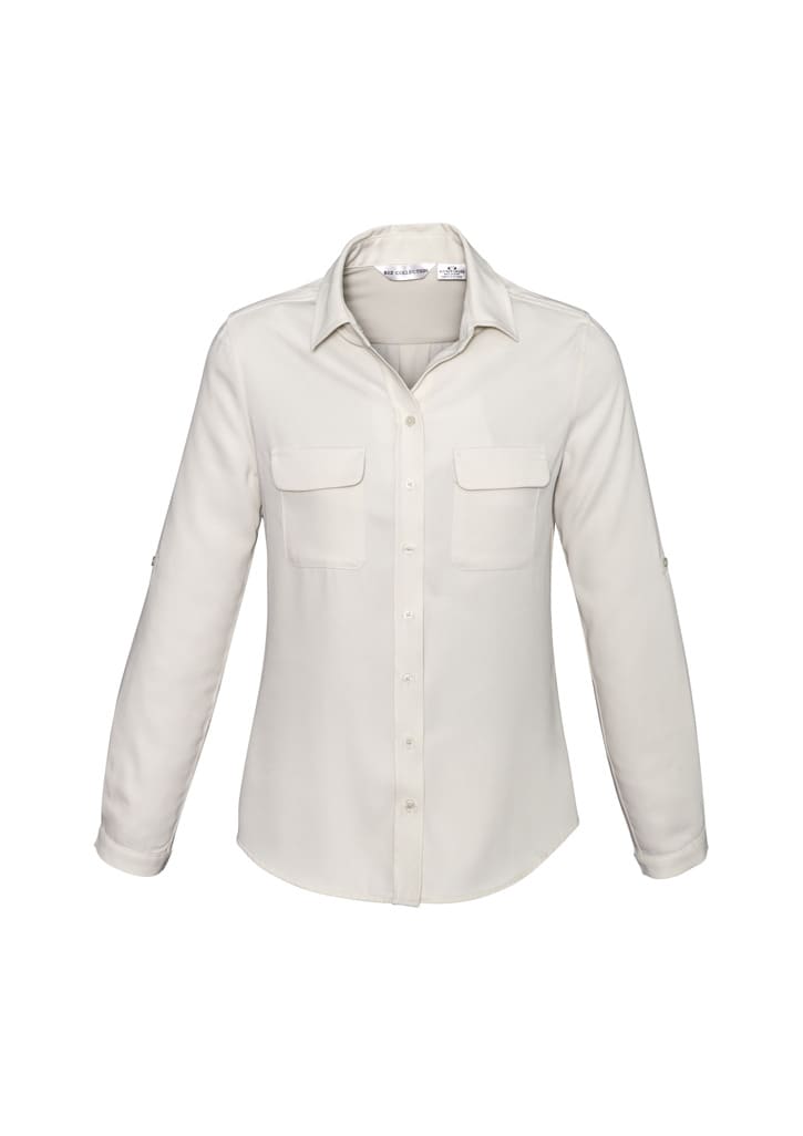 A women's button-up shirt in cream, featuring a collar and two front pockets. The shirt has long sleeves.