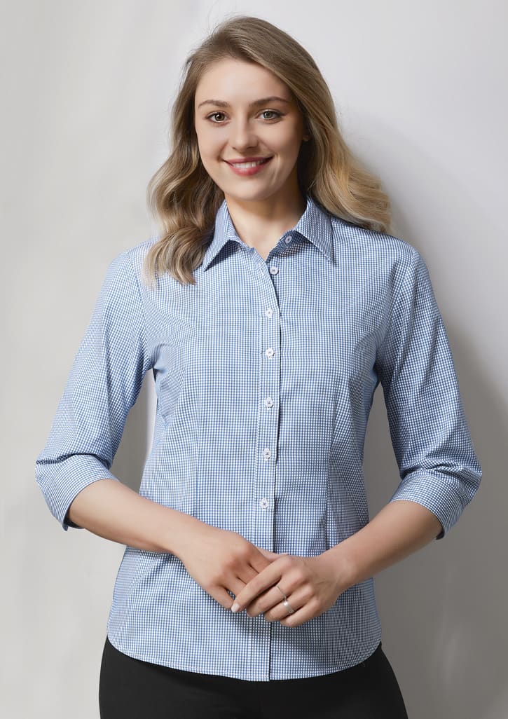 A women's button-up shirt in blue and white check pattern with 3/4 sleeves, featuring a collar and buttons.