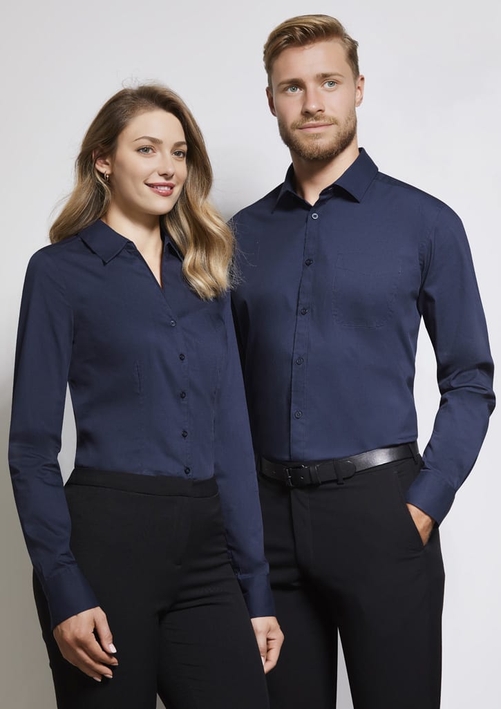 A navy blue long sleeve button-up shirt displayed on a male and female model. The shirt features a logo.