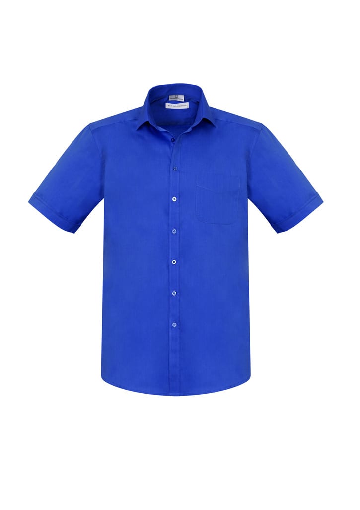 A blue short sleeve button-up shirt with a chest pocket and a logo on the label.