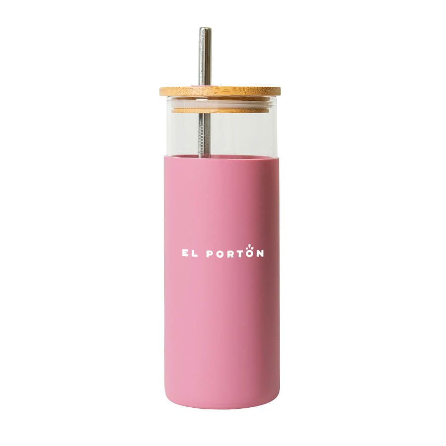 A drink bottle with a pink plastic exterior, clear glass inner, and wooden lid, featuring a logo on the front.