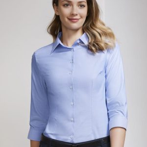 A light blue women's button-up shirt with a 3/4 sleeve design and a collar, featuring a logo.
