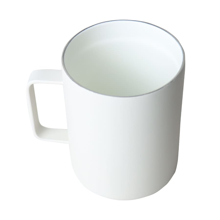 A travel mug in white with a minimalist design and a handle. Features a logo on the surface.
