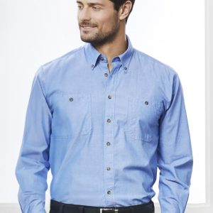 A men's long sleeve chambray shirt in light blue, featuring a button-up design and two front pockets.