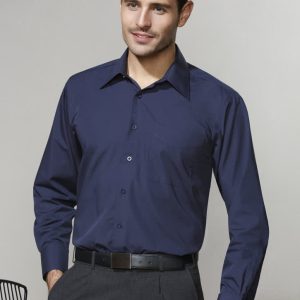 A navy blue long sleeve button-up shirt on a model, featuring a collar and a logo on the chest.