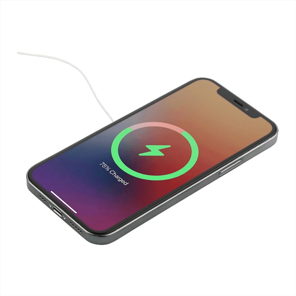 A smartphone on a wireless charging pad, displaying a charging indicator in green and pink tones.