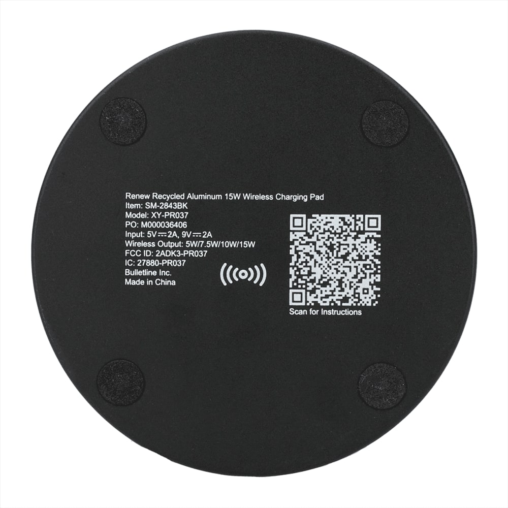 A wireless charging pad made of recycled aluminium in black, featuring a circular design and a logo.
