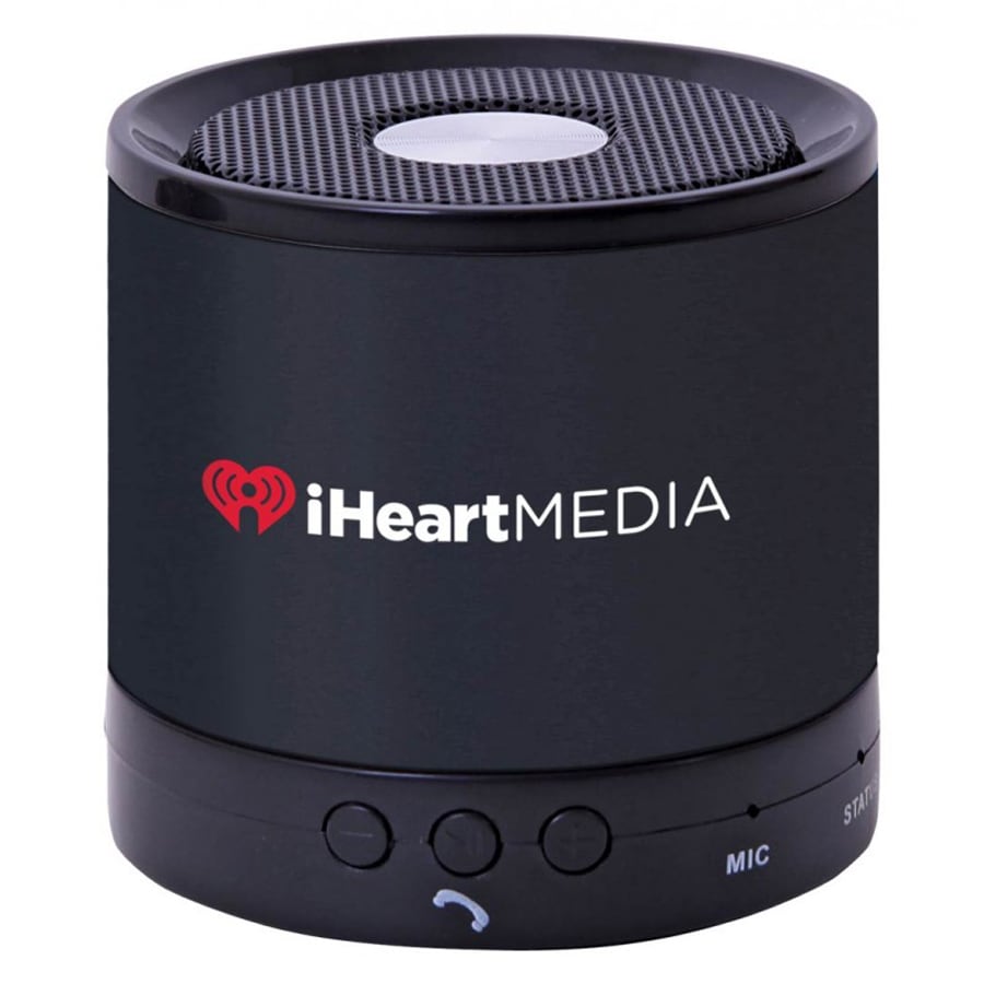 A black portable speaker with a mesh top and a logo on the front, featuring control buttons on the base.