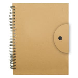 A tan spiral-bound notebook with a circular fastener on the front cover and a textured finish.