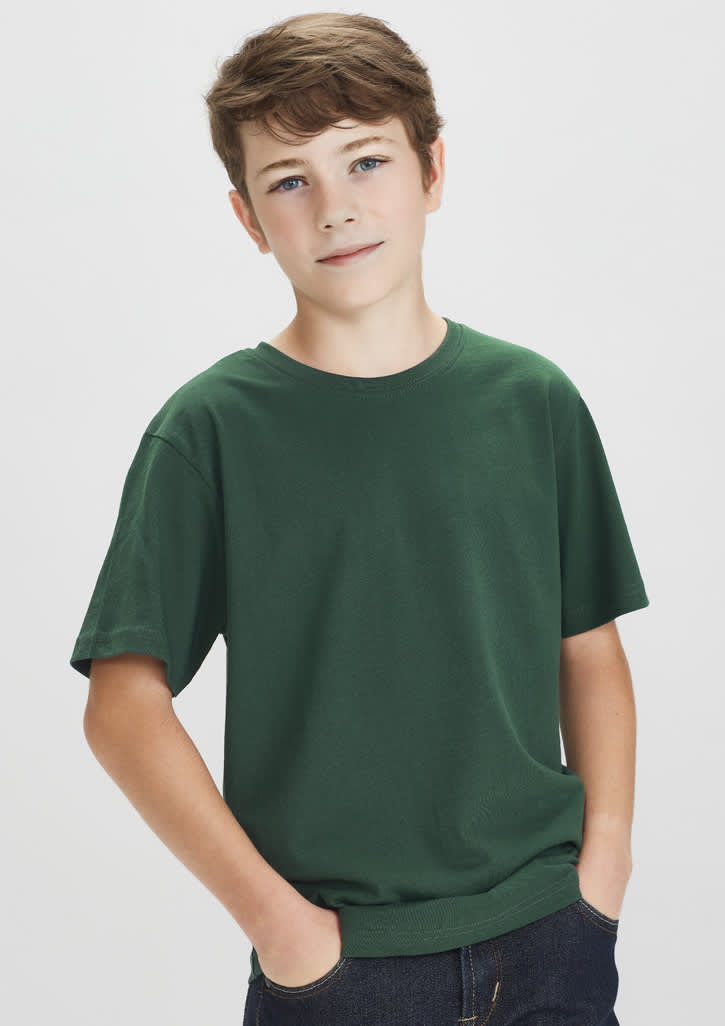A green short sleeve tee for kids, displayed on a young boy with a neutral expression. The tee has a logo.