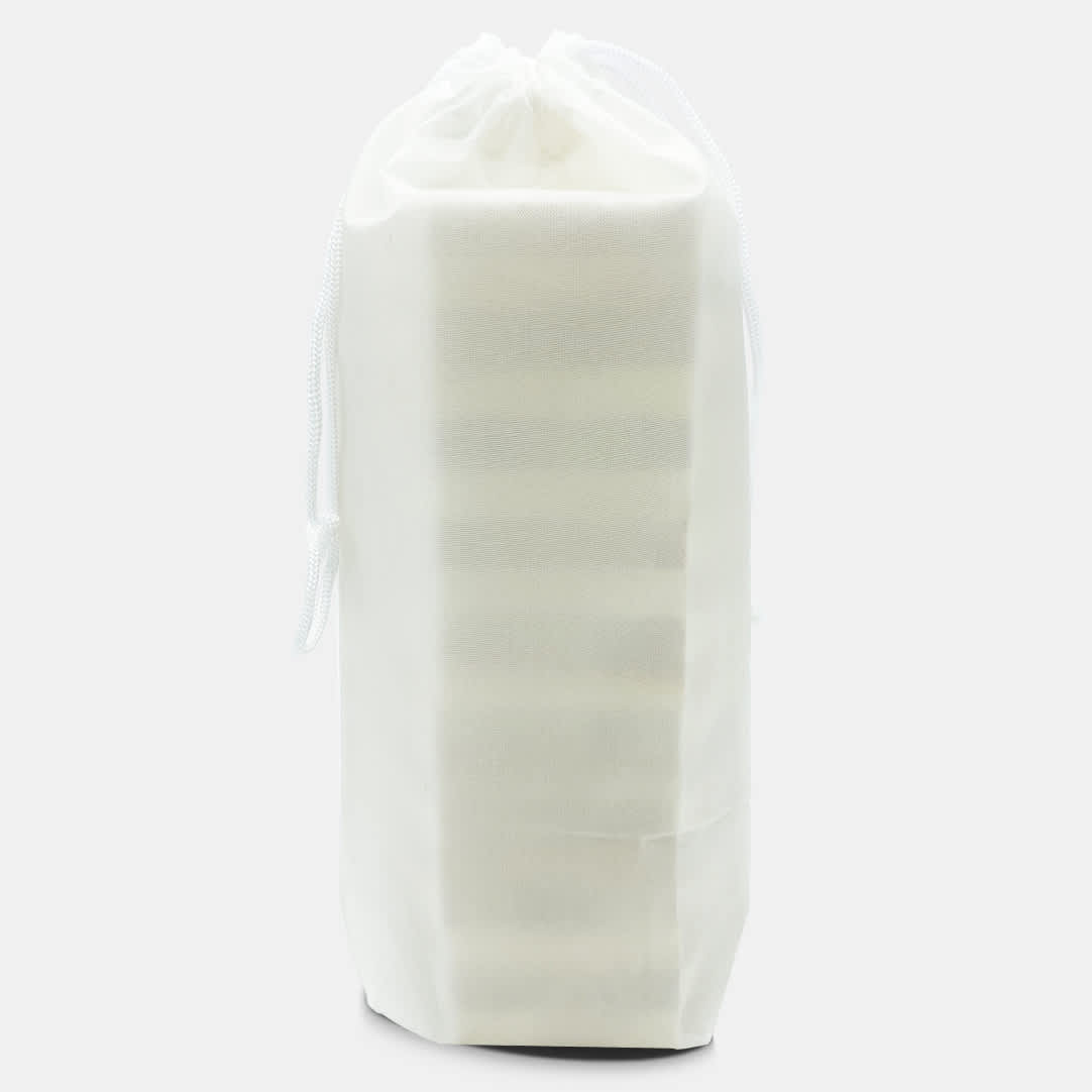 A white pouch containing a stacking puzzle set. The pouch is tied at the top with a drawstring.