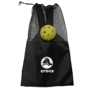 A black mesh bag containing a yellow pickle ball, featuring a logo on the front.