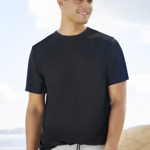 A black men's short sleeve tee worn by a model, paired with grey shorts and a cap in a scenic outdoor setting.