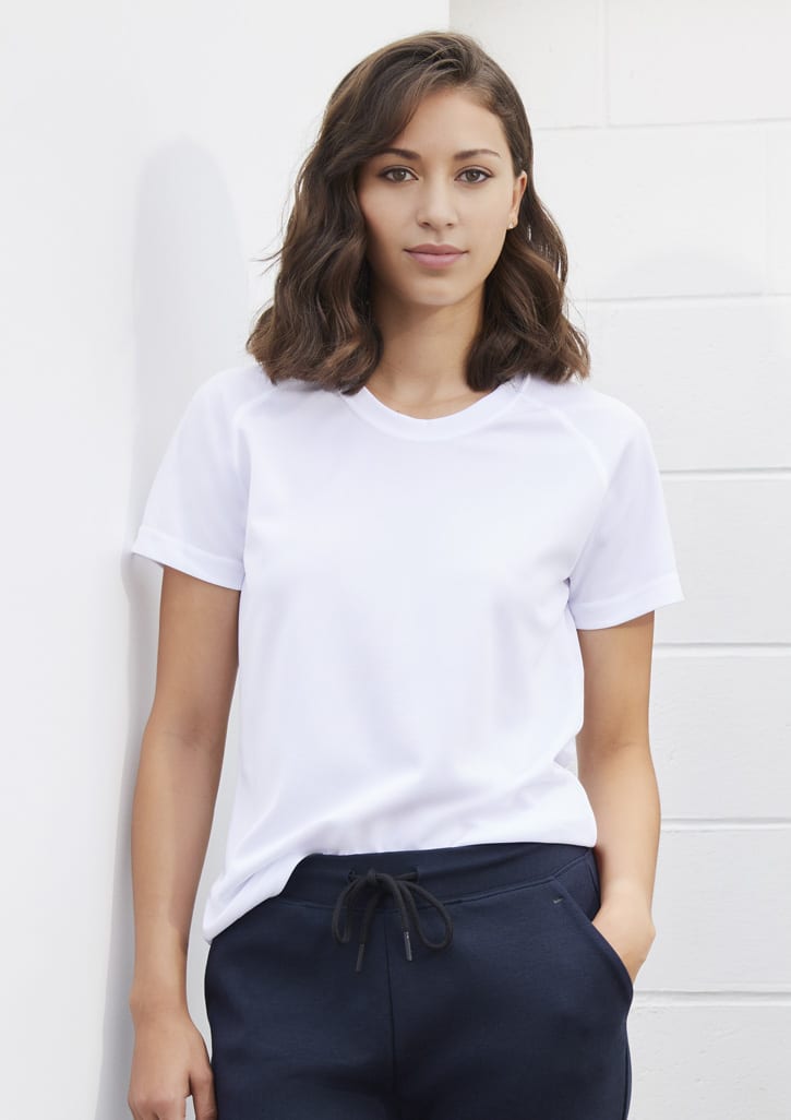 A white women's short sleeve tee displayed on a model, featuring a simple design and a round neckline.