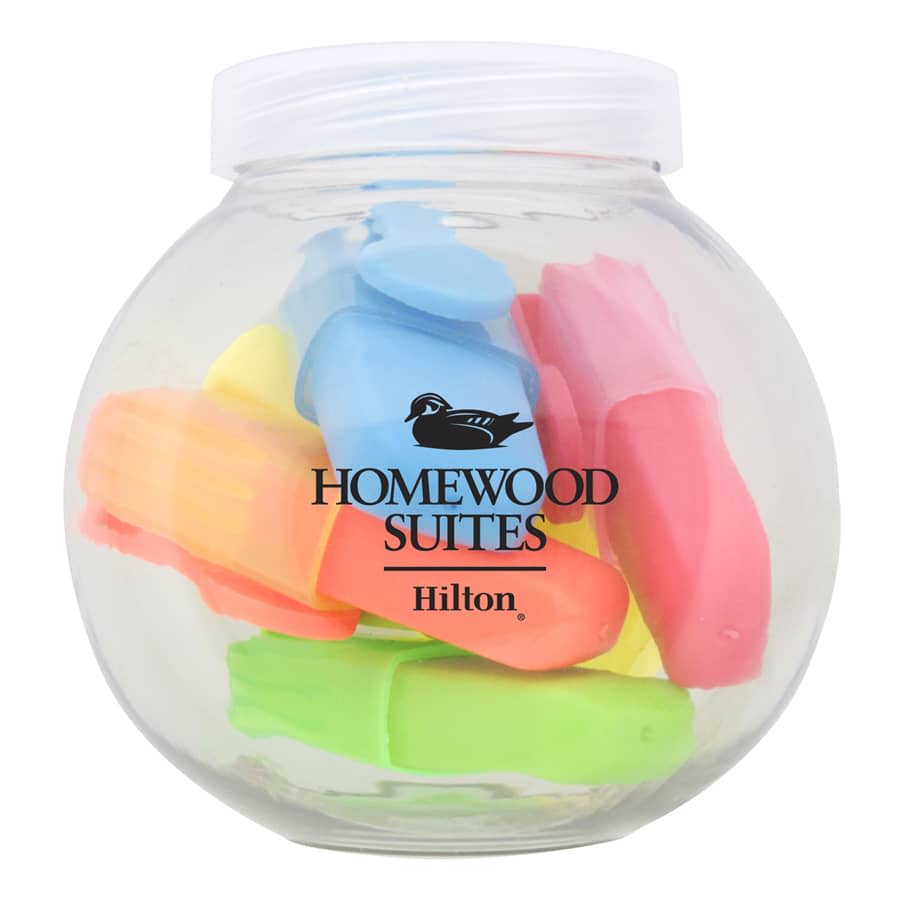 A clear jar contains an assortment of highlighters in pink, yellow, green, and blue, featuring a logo.