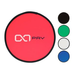 A red fold-up flying disc is displayed, alongside black, green, white, and blue options. The disc features a logo.