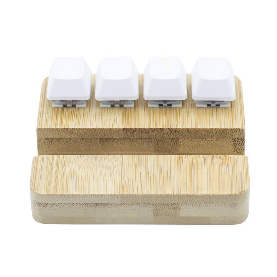 A bamboo stand holder featuring four white key pressing stress relievers on top.