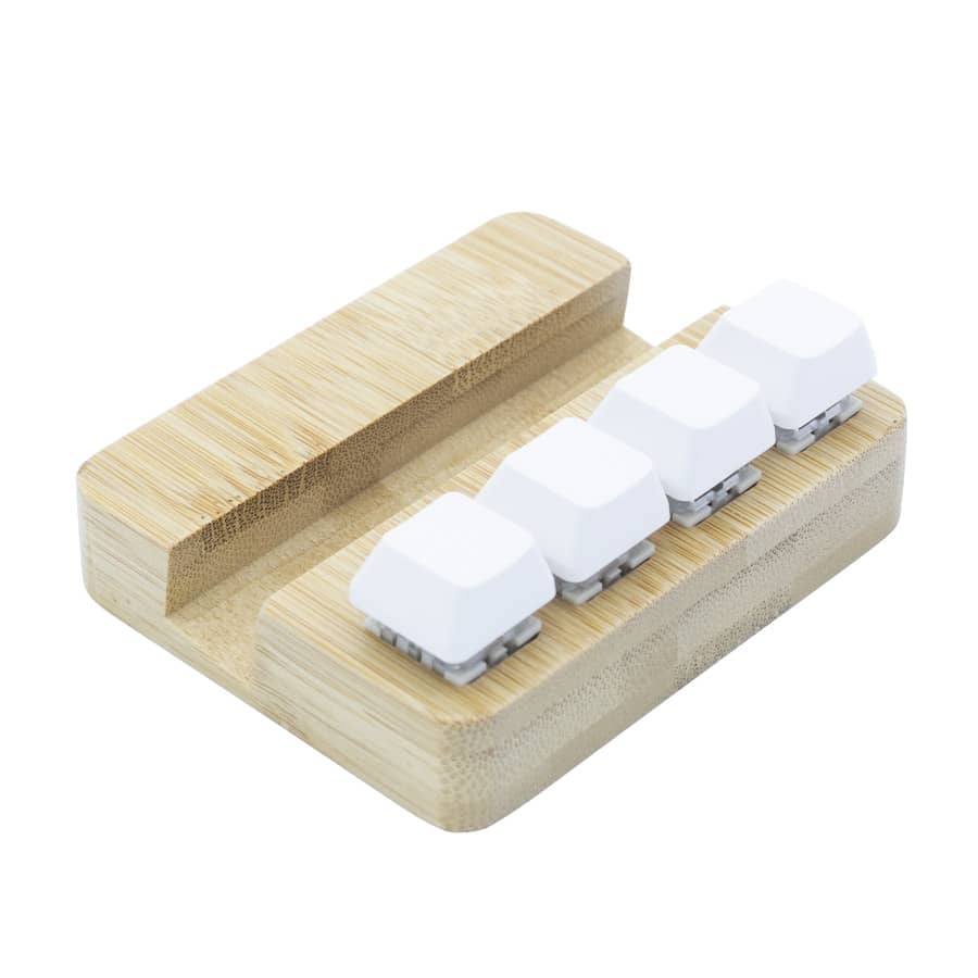 A bamboo stand holder featuring four white key pressing stress relievers. It has a smooth, natural finish.