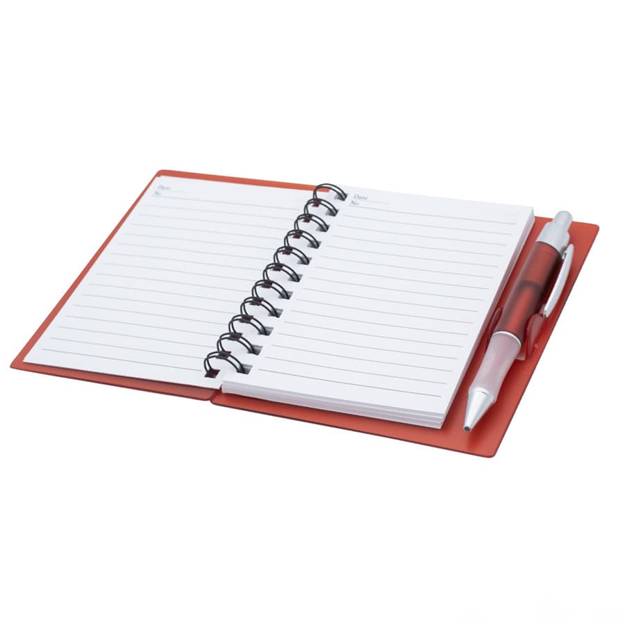 A red notepad with lined pages and a matching pen, featuring a spiral binding and a sleek cover.