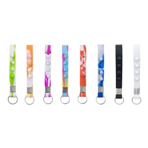 A selection of Popper Stress Reliever Key Chains in various colours, featuring three poppable buttons and a keyring.