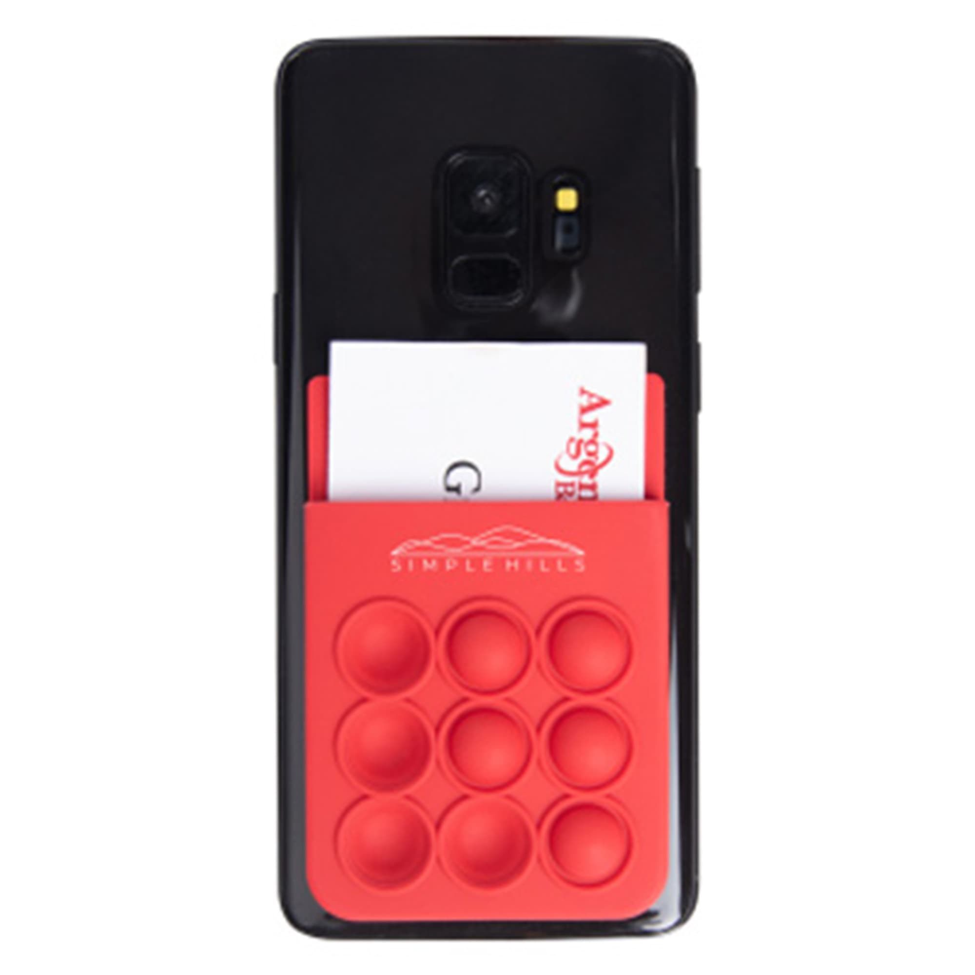 A red silicone phone wallet featuring popper stress reliever bubbles attached to a smartphone with a card inserted.