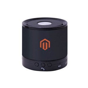 A black portable speaker with a circular design, featuring a textured top and a branded logo.