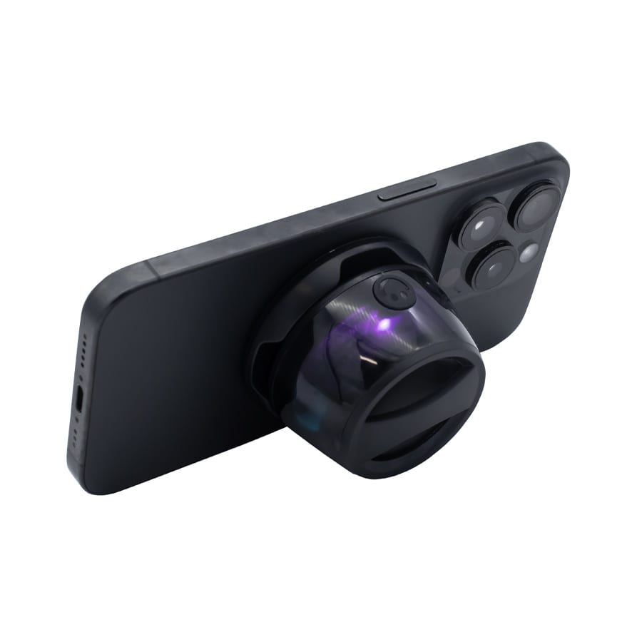 A speaker attachment in black, designed to connect to a smartphone, featuring a circular design and a branding logo.