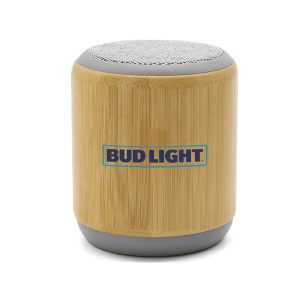 A bamboo Bluetooth speaker with a grey base and a branded logo on the front.